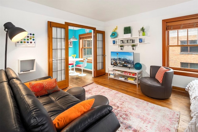 living room featuring hardwood / wood-style flooring and french doors