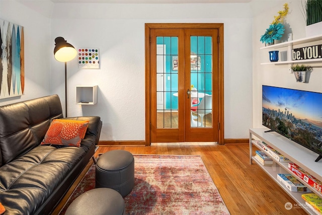 doorway to outside with light wood-type flooring and french doors