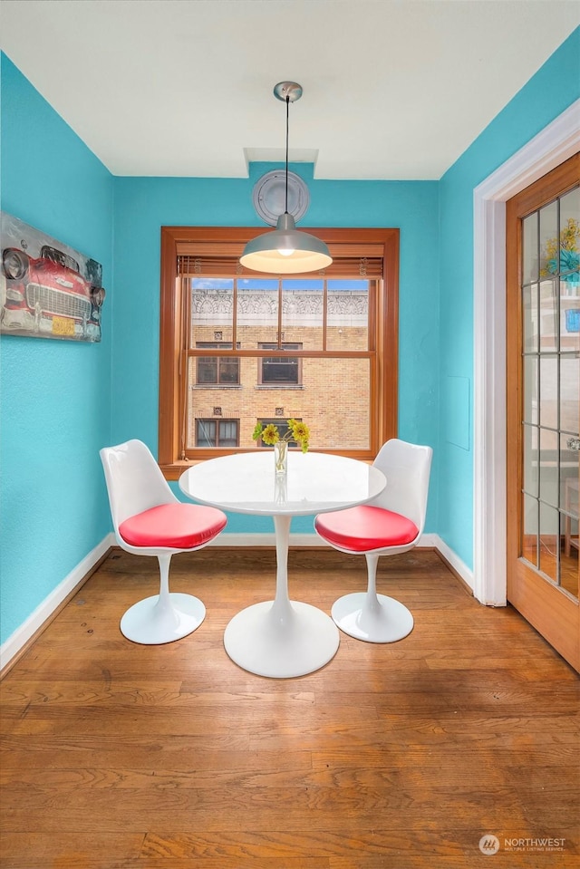 unfurnished dining area featuring hardwood / wood-style floors