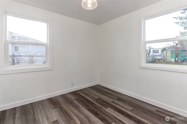 unfurnished room featuring dark hardwood / wood-style flooring