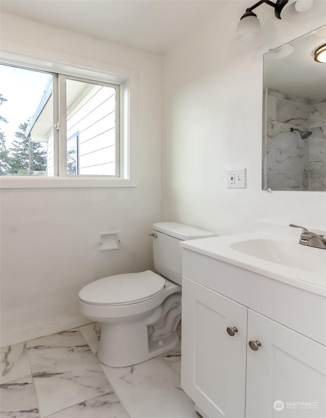 bathroom featuring toilet and vanity