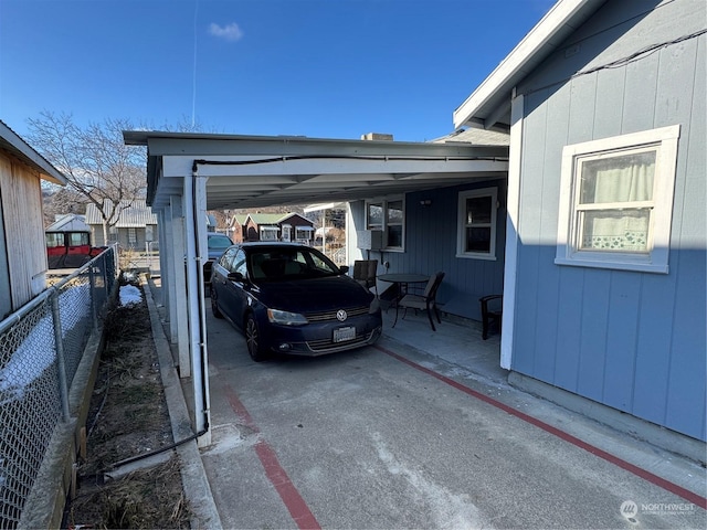 view of parking / parking lot featuring a carport