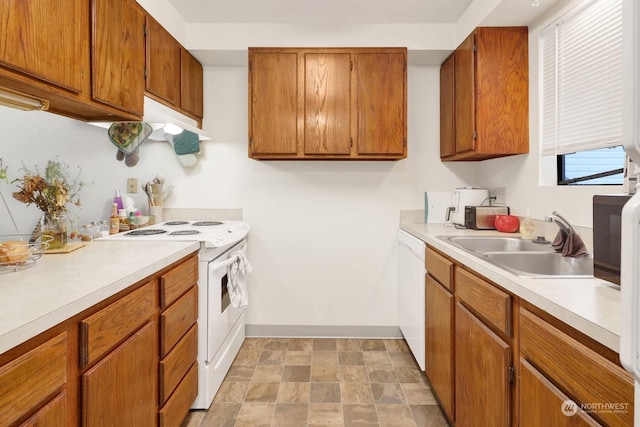 kitchen featuring sink and white appliances