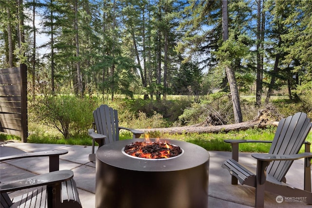 view of patio / terrace with a fire pit