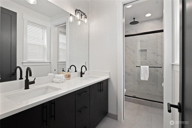 bathroom with vanity and a shower with shower door