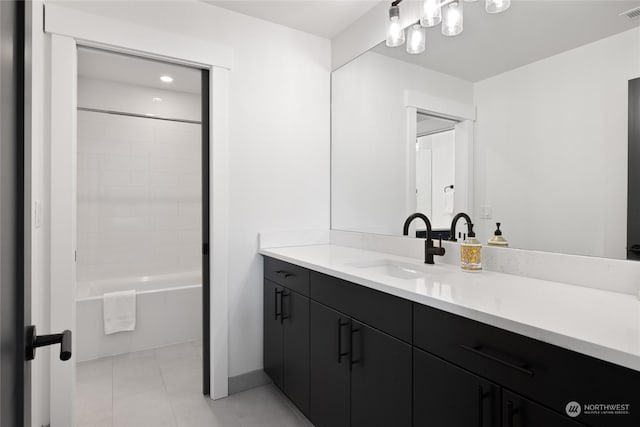 bathroom featuring shower / bath combination, vanity, and tile patterned flooring