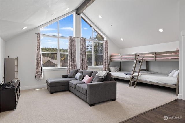 bedroom with hardwood / wood-style flooring and lofted ceiling with beams