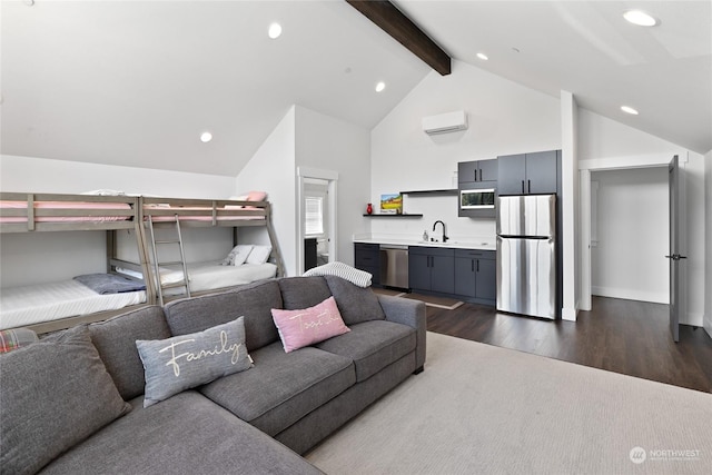 bedroom with sink, stainless steel refrigerator, beam ceiling, dark hardwood / wood-style floors, and a wall mounted air conditioner