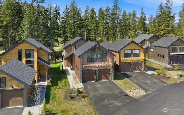 view of front of home featuring a garage and a front yard