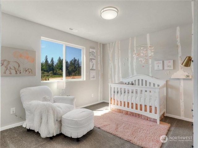 bedroom featuring carpet floors and a nursery area