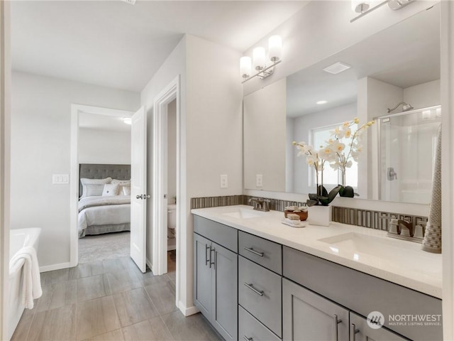 bathroom featuring vanity, toilet, and walk in shower