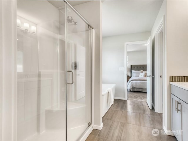 bathroom with an enclosed shower and vanity