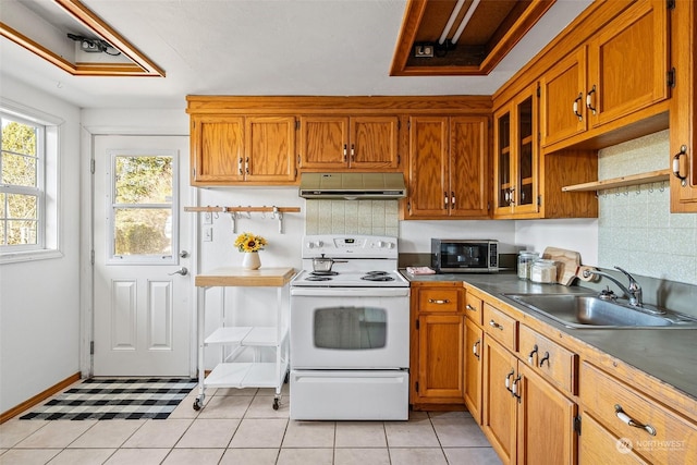 22214 Zenker Valley Rd SW, Centralia, WA 98531 - kitchen with sink, decorative backsplash, light tile patterned floors, and white electric range