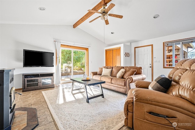 22214 Zenker Valley Rd SW, Centralia, WA 98531 - living room with ceiling fan, a wood stove, light tile patterned floors, and vaulted ceiling with beams