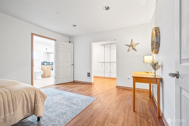22214 Zenker Valley Rd SW, Centralia, WA 98531 - bedroom with ensuite bathroom and light hardwood / wood-style floors