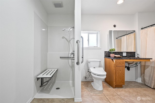 22214 Zenker Valley Rd SW, Centralia, WA 98531 - bathroom featuring toilet, a shower with shower curtain, and tile patterned flooring