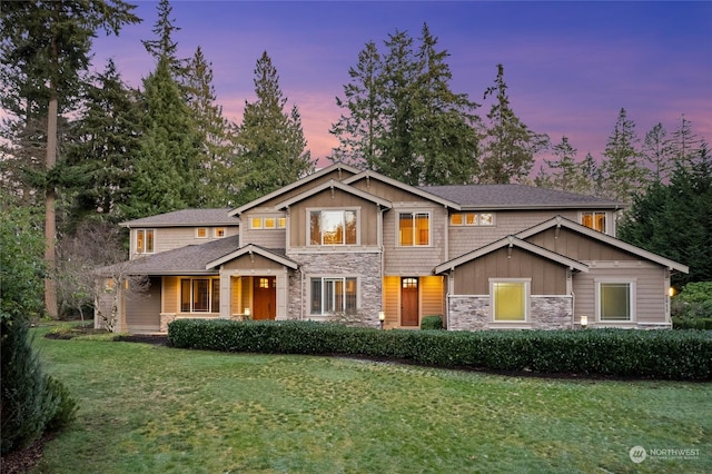 craftsman inspired home featuring a lawn