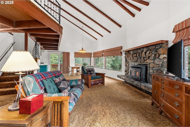 carpeted living area featuring baseboards, plenty of natural light, high vaulted ceiling, and beam ceiling