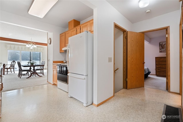 kitchen with light brown cabinetry, white appliances, a chandelier, and hanging light fixtures