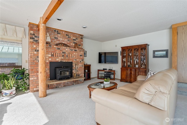 carpeted living room featuring a textured ceiling and a wood stove