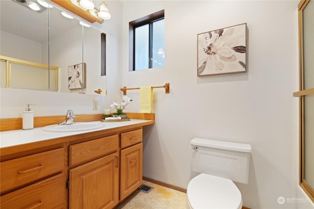 bathroom with toilet and vanity