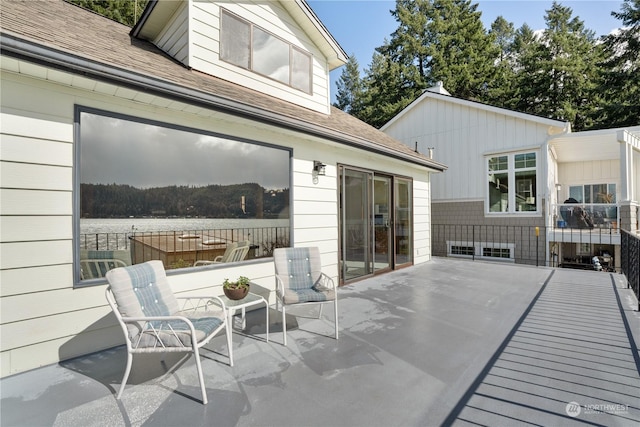 view of patio with a water view