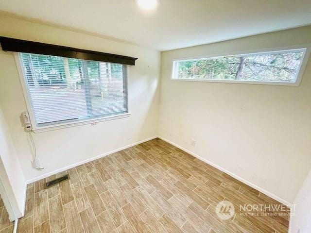 empty room featuring hardwood / wood-style floors