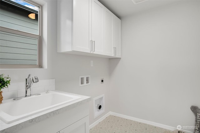 laundry area featuring washer hookup, sink, hookup for an electric dryer, cabinets, and light tile patterned flooring