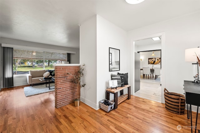 hallway with hardwood / wood-style flooring