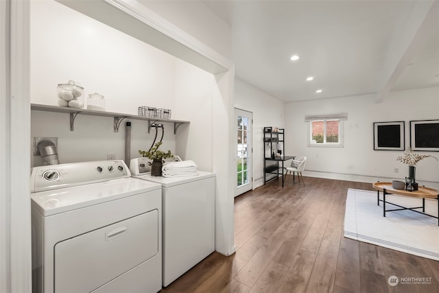 laundry room featuring dark hardwood / wood-style flooring and washer and clothes dryer