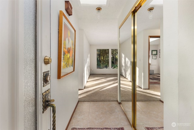 corridor with light colored carpet