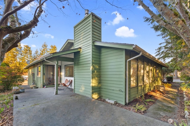 view of property exterior featuring a patio