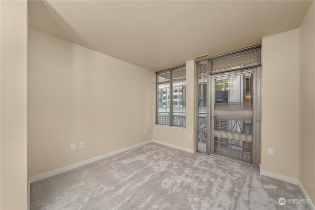 empty room featuring light colored carpet