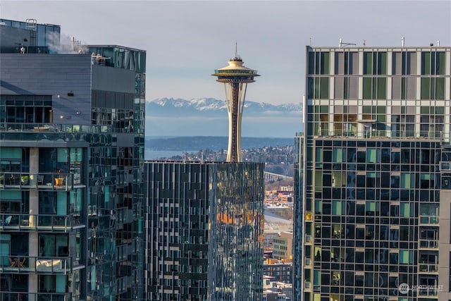 property's view of city featuring a mountain view