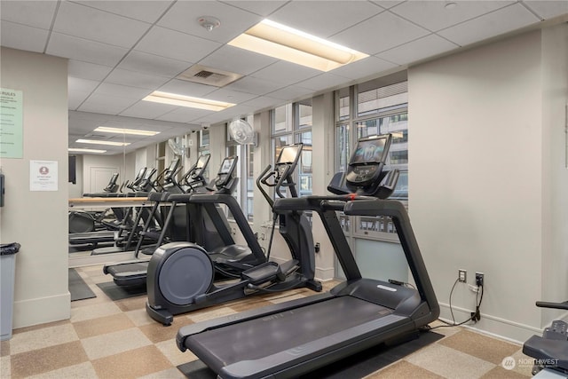 workout area featuring a drop ceiling