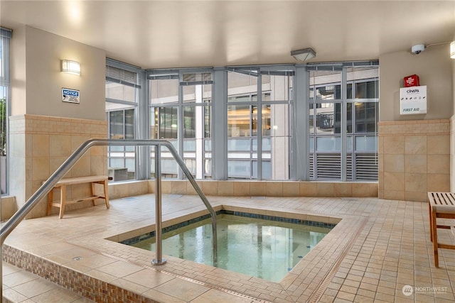 view of pool featuring an indoor hot tub