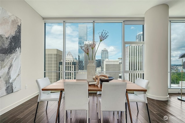 dining room featuring hardwood / wood-style flooring and floor to ceiling windows