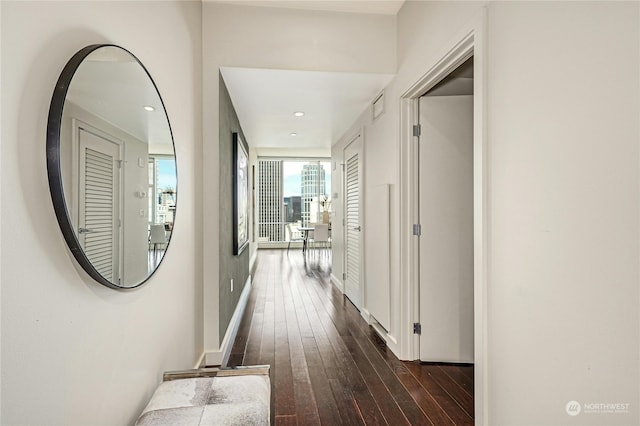 hallway featuring dark hardwood / wood-style flooring