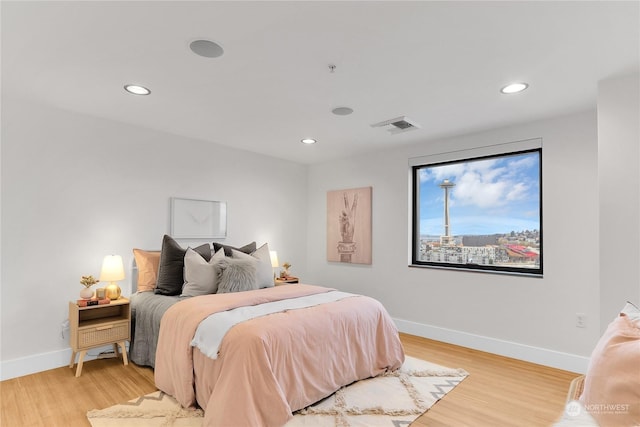 bedroom with light hardwood / wood-style floors