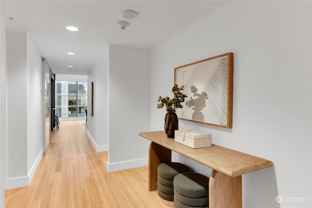 corridor featuring light hardwood / wood-style flooring