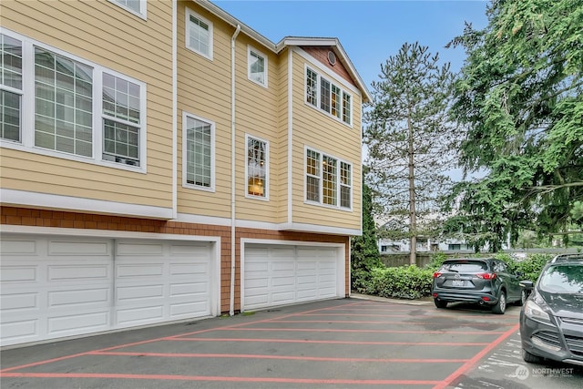 view of side of home with a garage