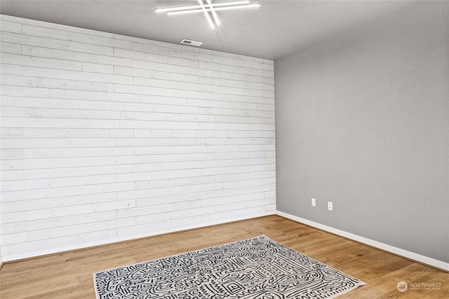 spare room featuring hardwood / wood-style floors