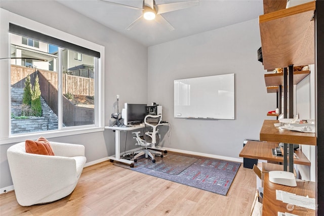 office area with hardwood / wood-style flooring and ceiling fan