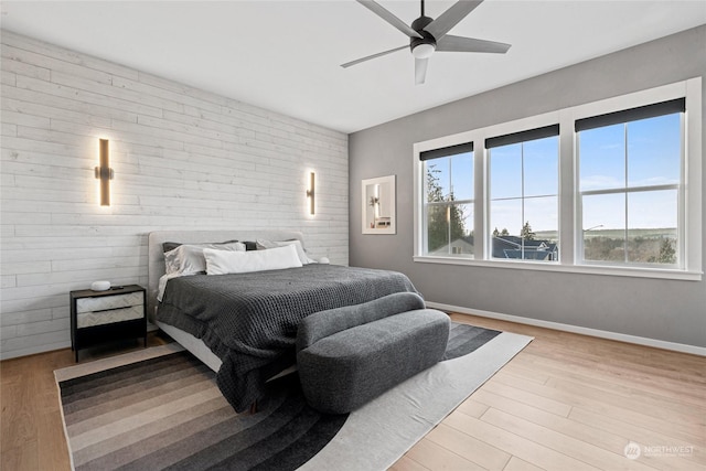 bedroom featuring light hardwood / wood-style flooring and ceiling fan