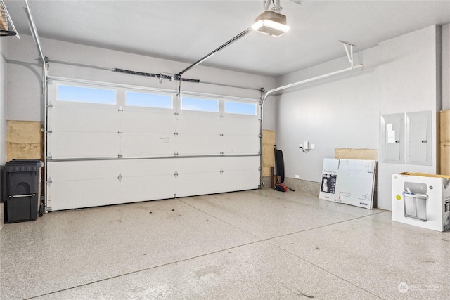 garage featuring a garage door opener and electric panel