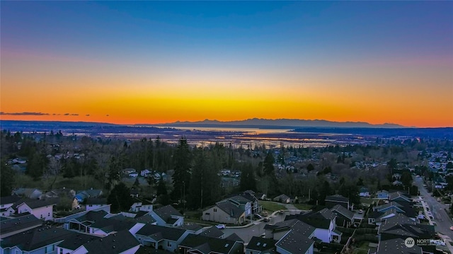 aerial view at dusk with a mountain view