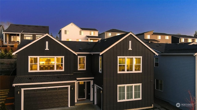 view of front of property with a garage