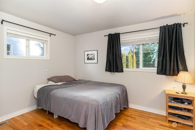 bedroom featuring light wood-type flooring