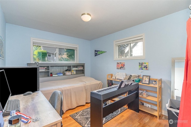 bedroom with hardwood / wood-style flooring