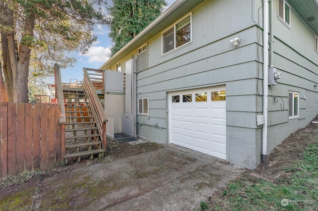 view of side of property featuring a garage